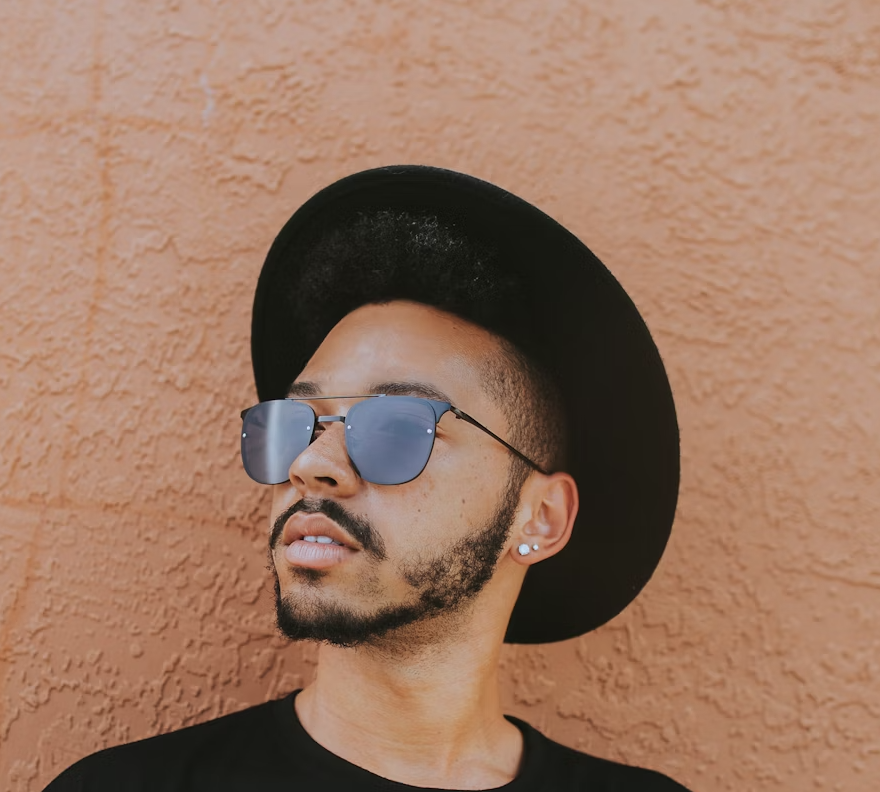 Man wearing hat and sunglasses