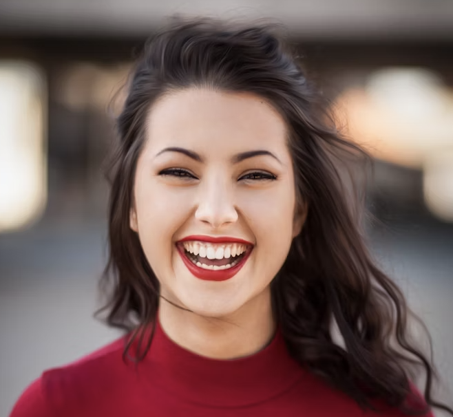 Smiling woman in red sweater